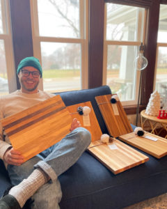 Sam Winternheimer holding edge grain cutting boards